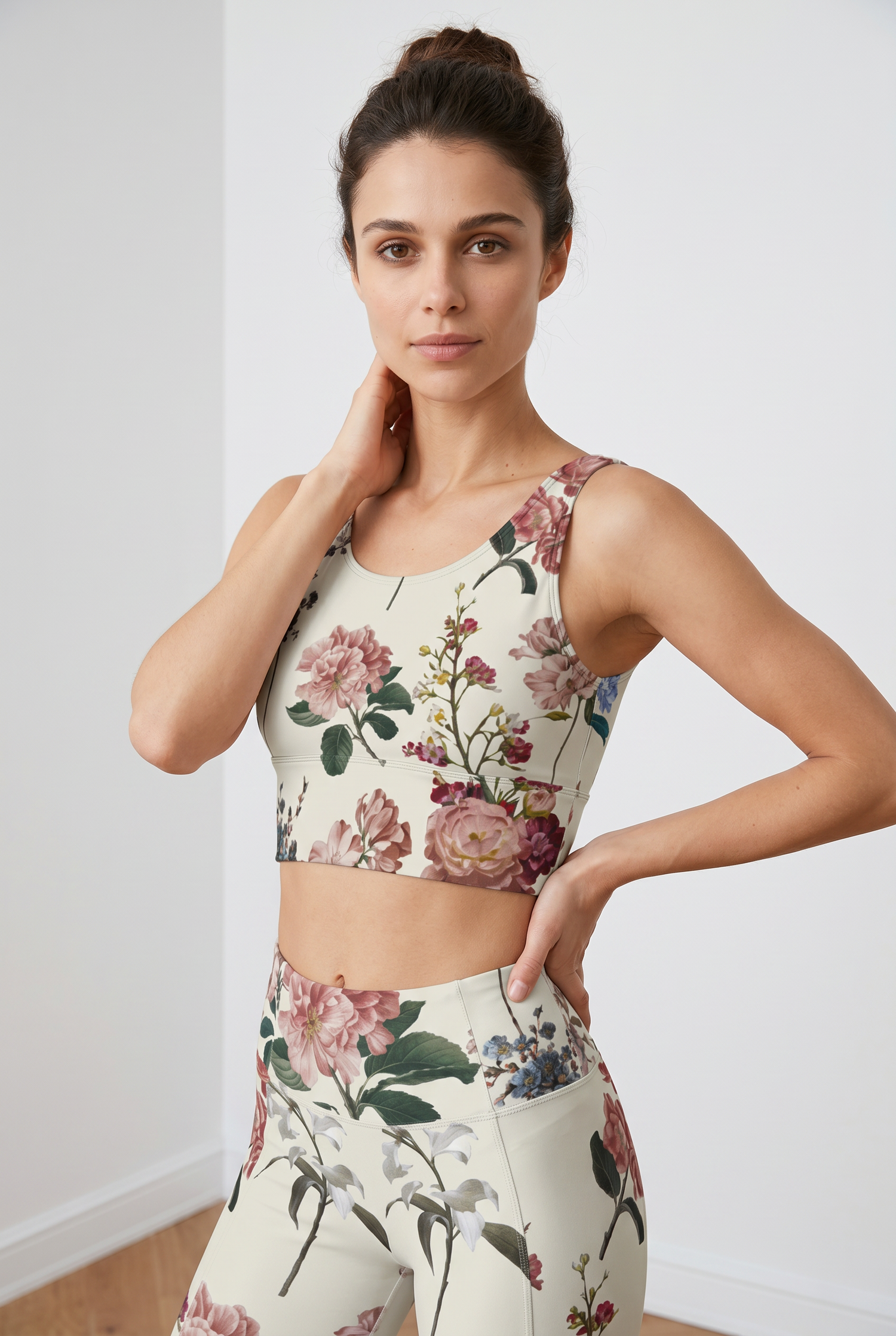 Cropped floral crop top featuring a U-back design, modeled with high-waisted floral leggings against a light background.