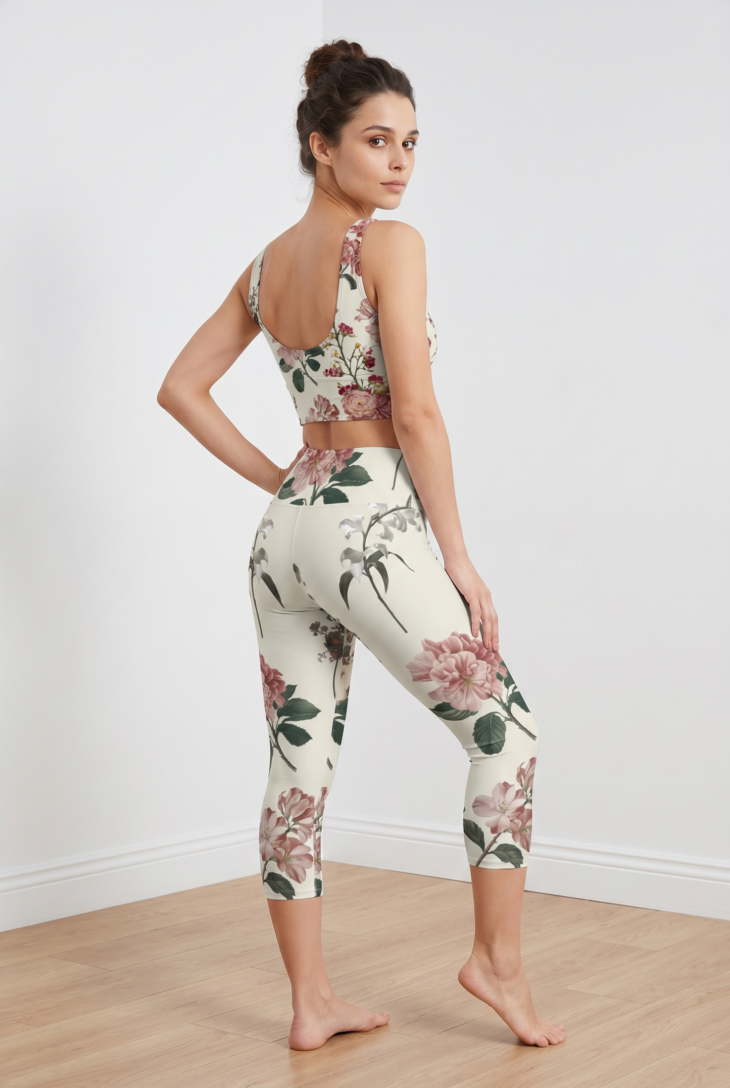 Cropped iSquared top featuring a floral print with a U-shaped back, paired with matching high-waisted leggings.