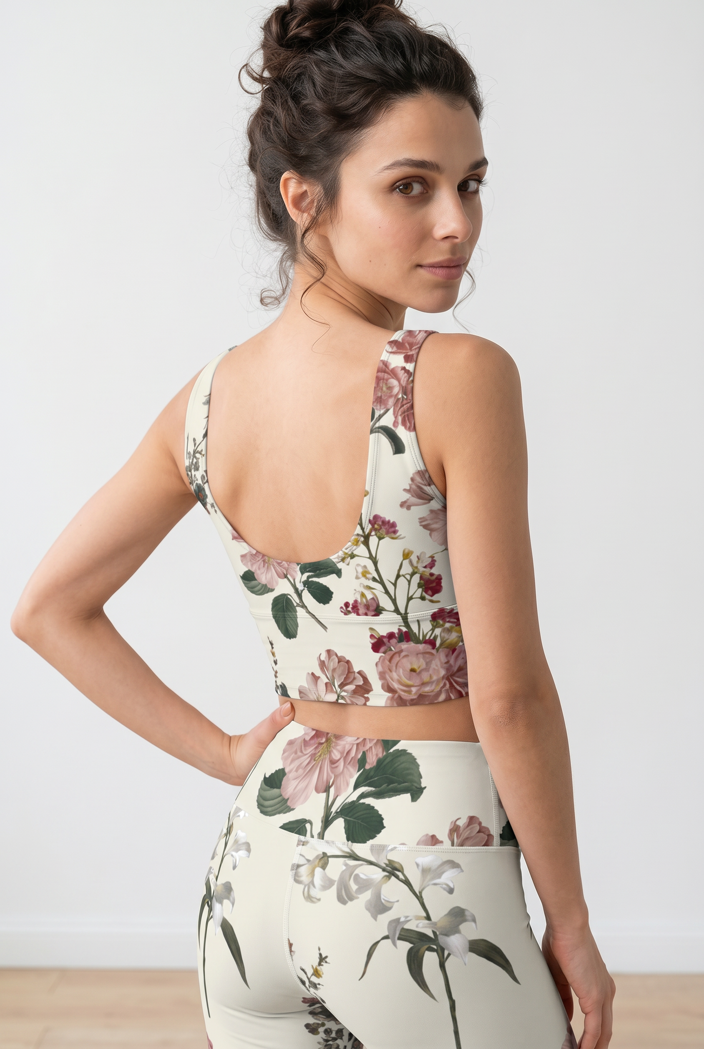 Cropped iSquared Crop Top in cream with floral print, featuring a U-shaped back and thick straps, worn with matching leggings.