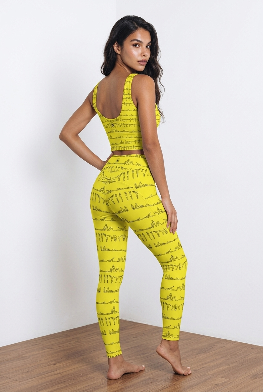 Yellow leggings featuring a repeating black graphic design of yoga postures, high-rise fit, snugly worn, no visible logos.