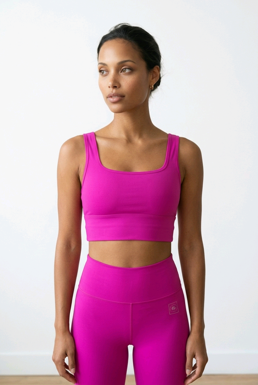 Vibrant Pure Fuschia crop top with removable pads and wide straps, paired with high-waisted matching leggings.